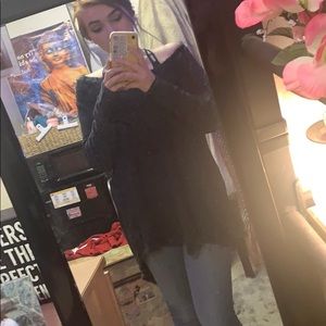 Cozy, grunge chic off the shoulder long sweater